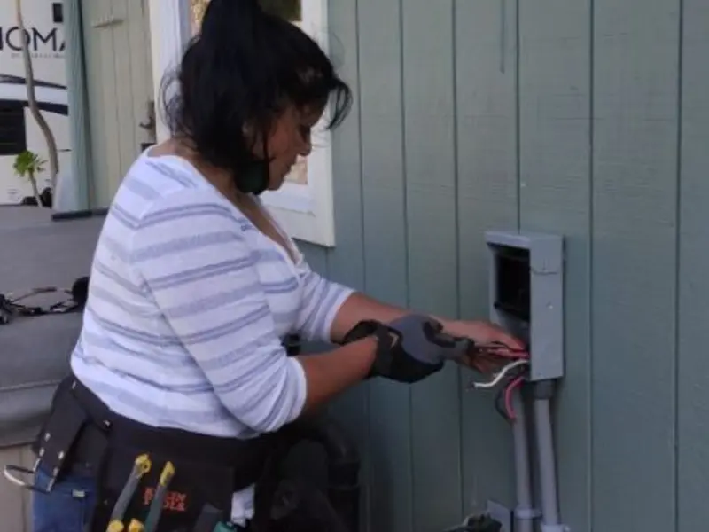 Licensed electrician wiring an exterior subpanel in Elkland